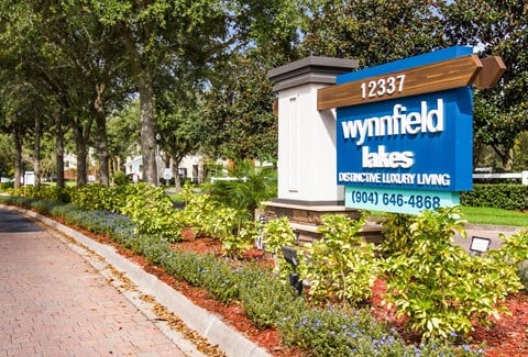 a sign for a wynnfield labs sign on the side of a road